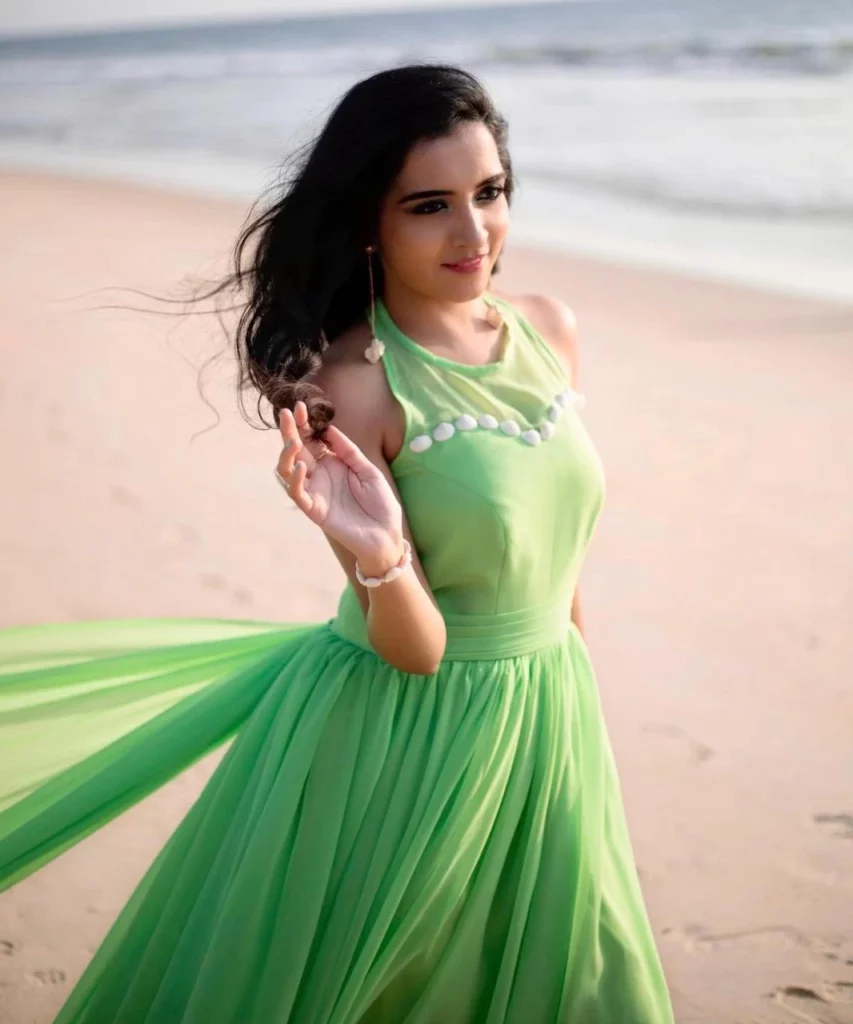 Sangeetha rajeev pop star wearing green dress on beach