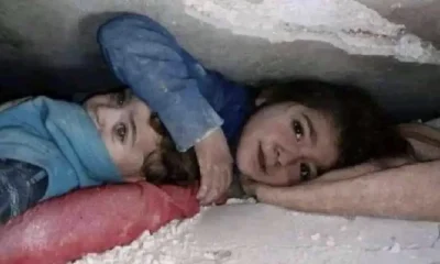 girl protects little brother under rubble photo viral