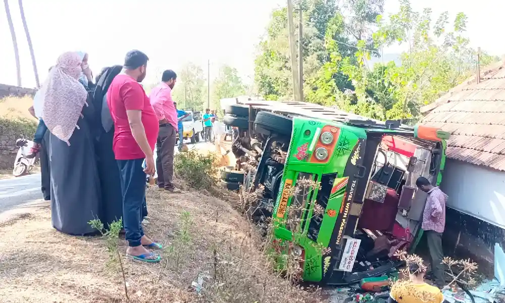 Private bus overturns after driver loses control