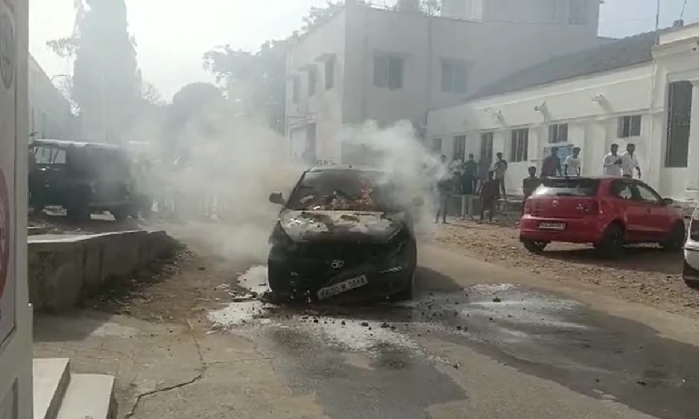 Fire Accident Car parked in district hospital premises catches fire