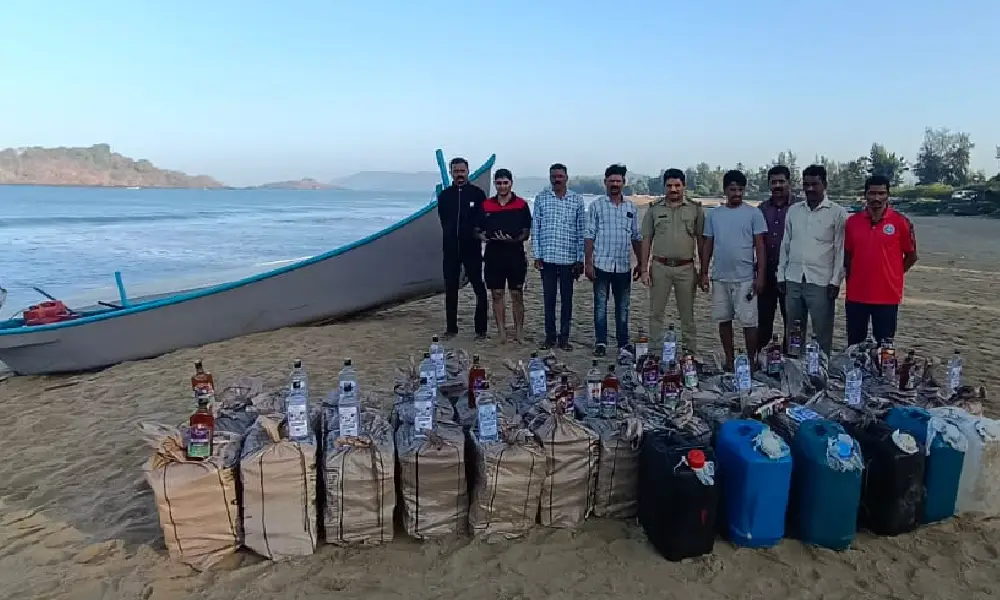 Karwar Coastal guard with siezed Liquor bottle