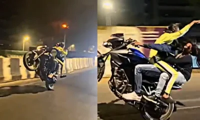 Man performs bike with 2 girls in Mumbai