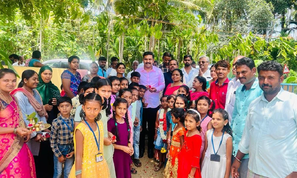 B Y Vijayendra with children and teachers in Shikaripura school