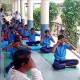 Students practicing yoga at Hulasur Government High School