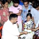 Minister Nagendra distributed checks at sanganakallu