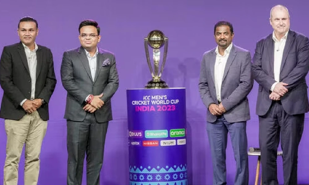 Former Indian cricketer Virender Sehwag, Secretary of Board of Control for Cricket in India Jay Shah, former Sri Lankan cricketer Muttiah Muralitharan and ICC chief Geoff Allardice pose with ICC Men's Cricket World Cup trophy during the announcement of match schedule.