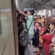 Man Hangs To Runnig Train