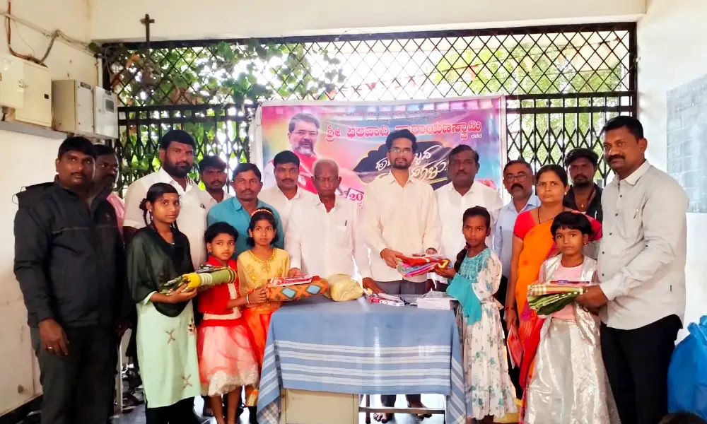 Notebooks and pens were distributed to the students at Yadgiri