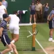 Novak Djokovic smashes his racquet on net pole