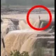 Woman Jumps Into Waterfall