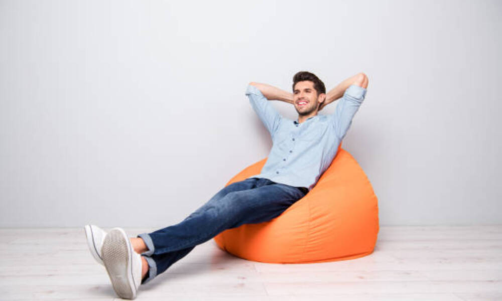 man sitting in easy chair