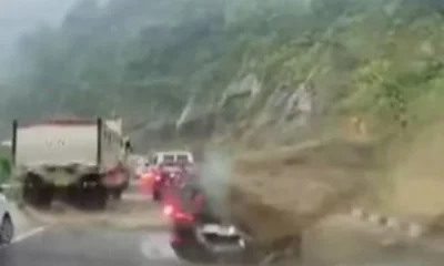 rock hit car