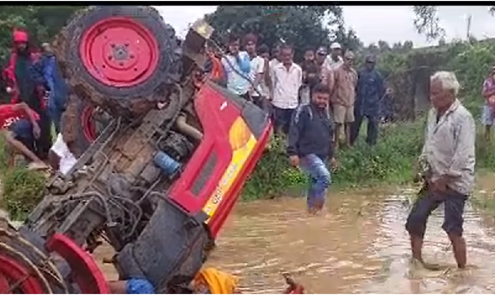 Tractor overturns while ploughing field 