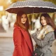 women in rain with umbrella