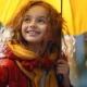 Girl standing in Rain with umbrella