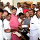 Minister distributes compensation check to families of deceased in Basarihala village in Koppala