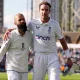 Stuart Broad and Moeen Ali walk off the pitch together for the last time