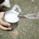 Feeding milk to the snake