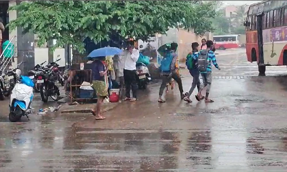 Vijayanagar people waking in rain 