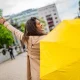 A beauty Girl holding Yellow Umbrella