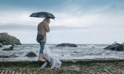 mother with child in beach with Rainy weather
