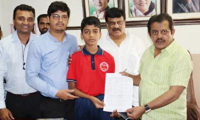 Minister Zameer Ahmed Khan helps international karate player boy