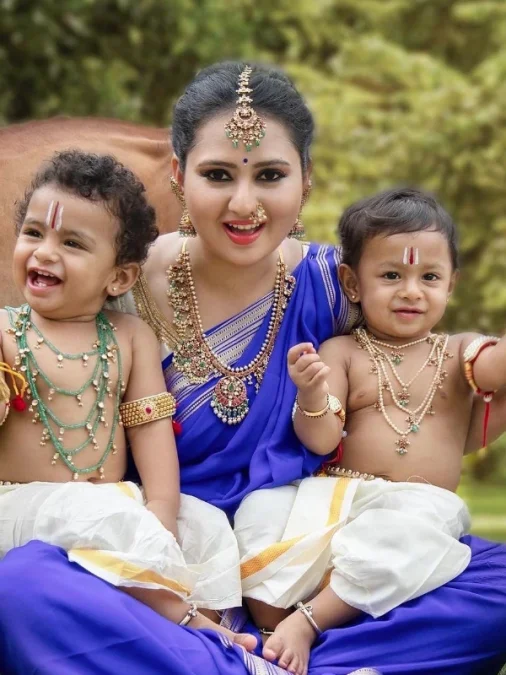 Amulya In blue saree with children