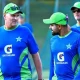 Pakistan's captain Babar Azam (R) talks with his team coach Grant Bradburn during a practice session