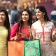 Indian women shopping at street market for Ganesha Chaturthi