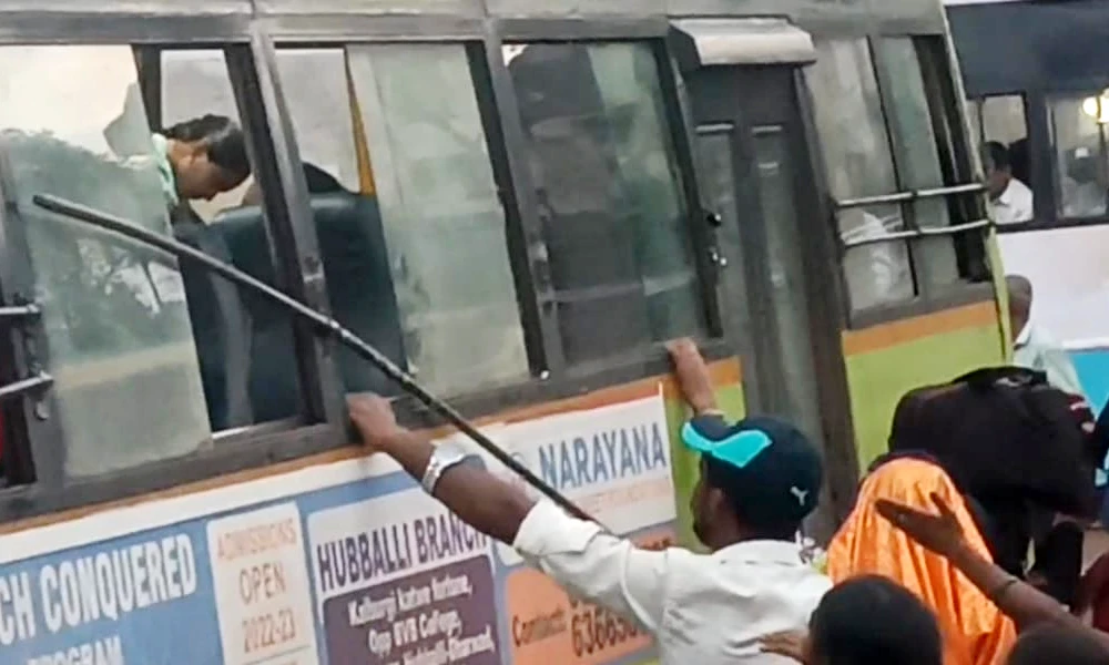 Passengers broke the steel pipe of the window to get a bus seat in Sirsi