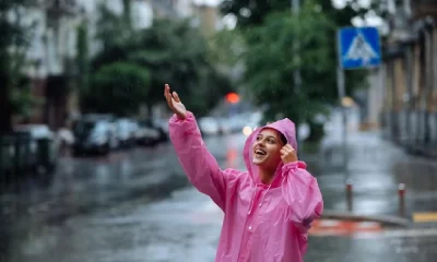 Girl standing in Road and enjoying Rain