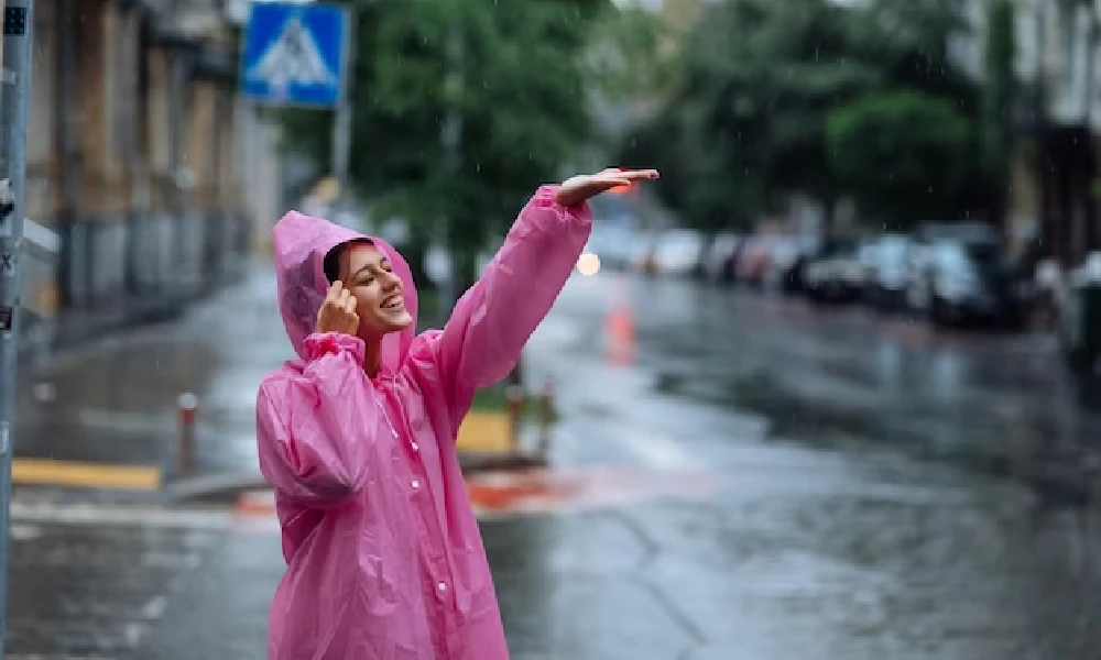 women enjoying rain in road