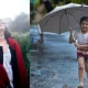 Women and boy enjoying rain