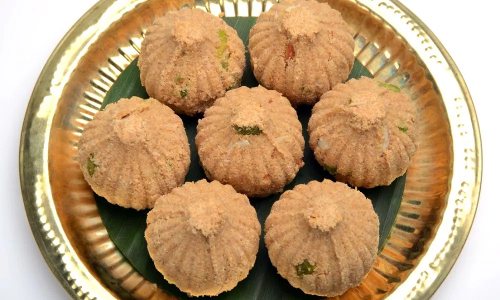 Rava and dry fruit Modak with Red hibiscus flower, Preperation for Ganesh Chaturthi or Ganesh Festival