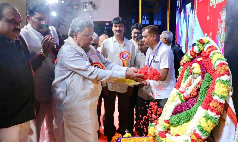 CM Siddaramaiah pays floral tributes to Vishwakarmas portrait