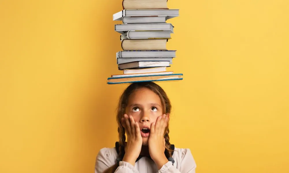 Young Child Student Worried Due to Too Much Books to Read and Study Yellow Background