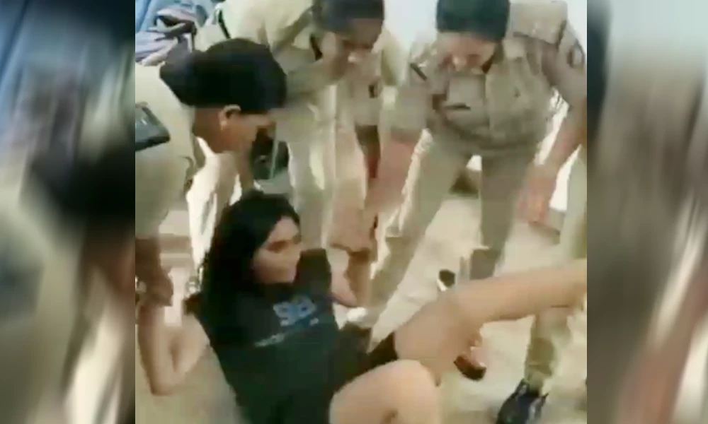 young woman kicked the police