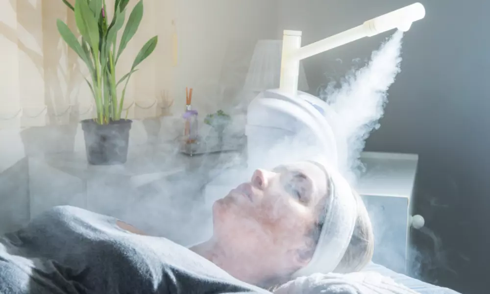 Beauty treatment of face with ozone facial steamer in beauty center
