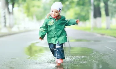 baby running in rain drops