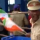 Of Cop Pulling Indian Flags Out Of Dustbin