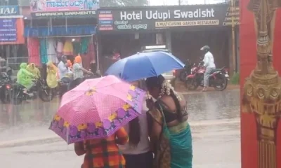 womens walking in rain