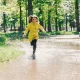 Girl running in rain
