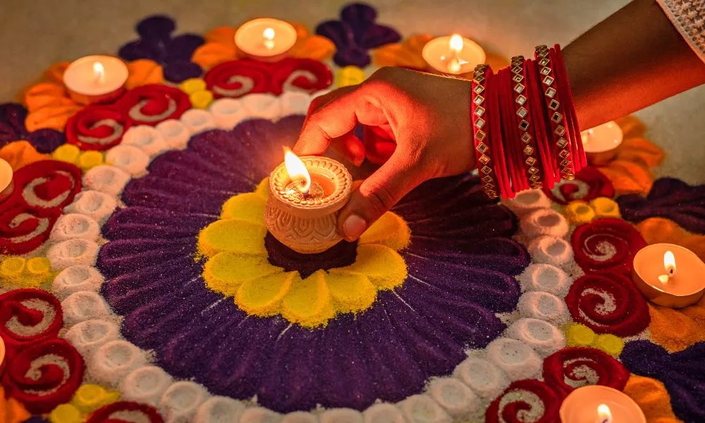 Rangoli Flower with Candles on Floor