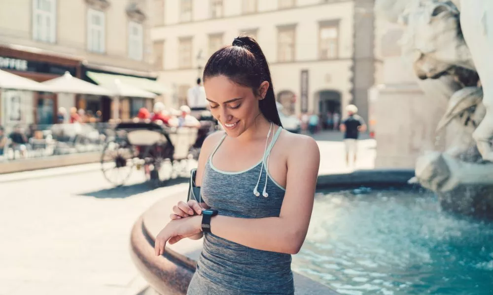 Sportswoman using smartwatch