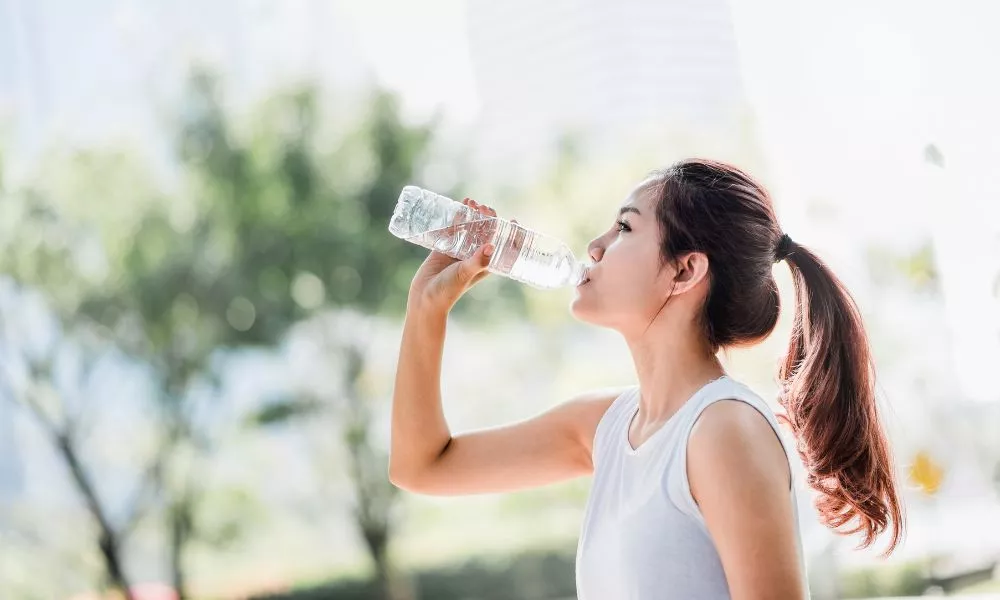 Sporty Woman Drinking Water