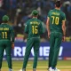 Temba Bavuma, Keshav Maharaj and Marco Jansen watch the replay of James Neesham's wicket