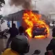 Car catches fire after hitting bus