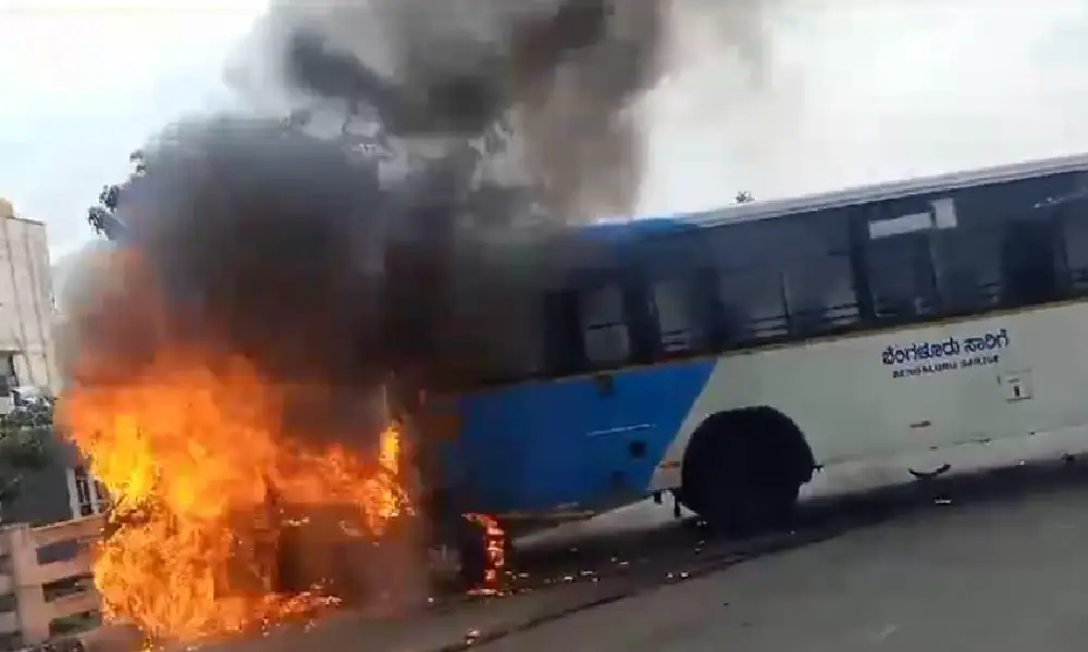 Car catches fire after hitting bus