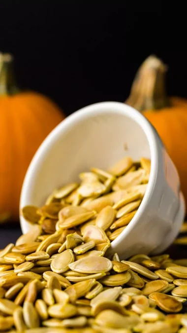 Pumpkin seeds in white bowl Pumpkin Seeds Benefits