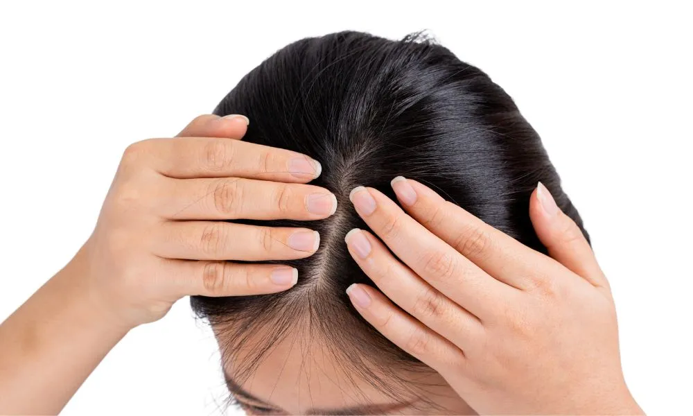 Woman Is Massaging the Scalp. Isolated on a White Background.